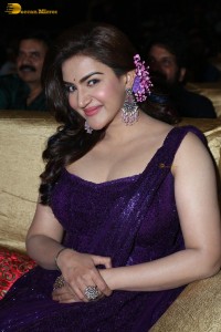 actress honey rose glamorous look in a purple dress at a function