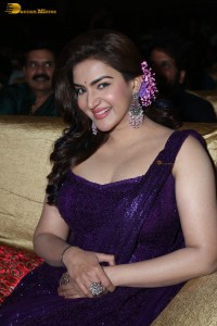 actress honey rose glamorous look in a purple dress at a function
