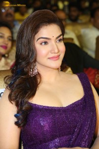actress honey rose glamorous look in a purple dress at a function