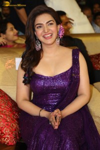 actress honey rose glamorous look in a purple dress at a function