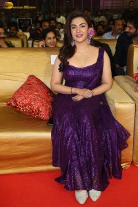 actress honey rose glamorous look in a purple dress at a function