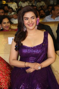 actress honey rose glamorous look in a purple dress at a function