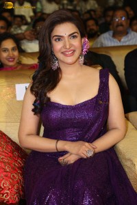 actress honey rose glamorous look in a purple dress at a function