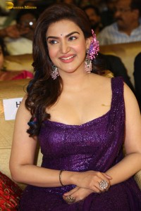 actress honey rose glamorous look in a purple dress at a function