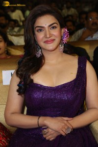 actress honey rose glamorous look in a purple dress at a function