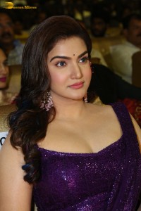 actress honey rose glamorous look in a purple dress at a function