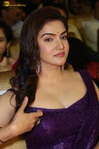 actress honey rose glamorous look in a purple dress at a function