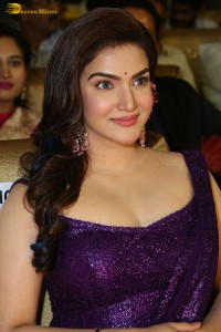 actress honey rose glamorous look in a purple dress at a function