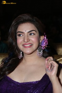 actress honey rose glamorous look in a purple dress at a function