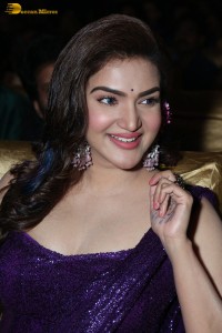 actress honey rose glamorous look in a purple dress at a function