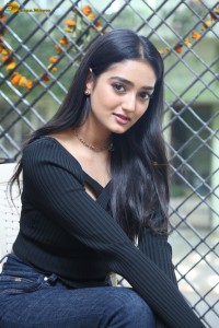 actress Hrithika Srinivas cute in a black top and jeans