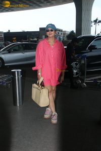 bollywood actress Huma Qureshi in a pink shirt at mumbai airport