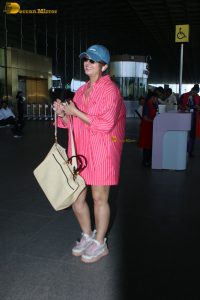 bollywood actress Huma Qureshi in a pink shirt at mumbai airport
