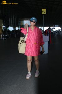 bollywood actress Huma Qureshi in a pink shirt at mumbai airport