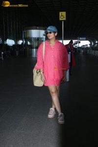 bollywood actress Huma Qureshi in a pink shirt at mumbai airport