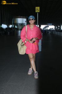 bollywood actress Huma Qureshi in a pink shirt at mumbai airport