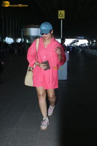 bollywood actress Huma Qureshi in a pink shirt at mumbai airport