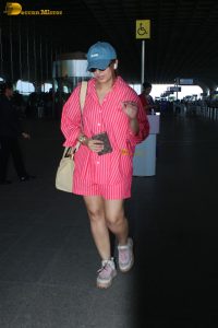 bollywood actress Huma Qureshi in a pink shirt at mumbai airport