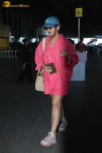 bollywood actress Huma Qureshi in a pink shirt at mumbai airport