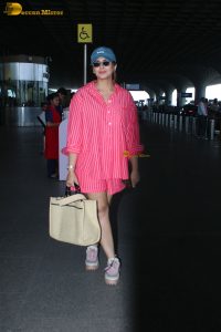 bollywood actress Huma Qureshi in a pink shirt at mumbai airport