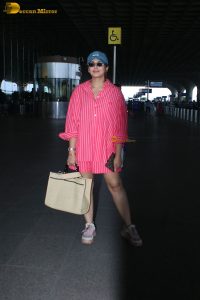 bollywood actress Huma Qureshi in a pink shirt at mumbai airport