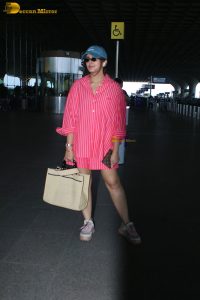 bollywood actress Huma Qureshi in a pink shirt at mumbai airport