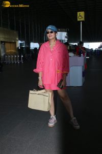 bollywood actress Huma Qureshi in a pink shirt at mumbai airport
