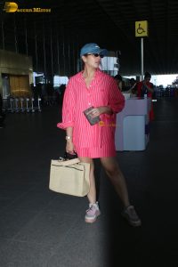 bollywood actress Huma Qureshi in a pink shirt at mumbai airport