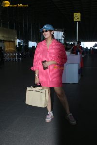 bollywood actress Huma Qureshi in a pink shirt at mumbai airport
