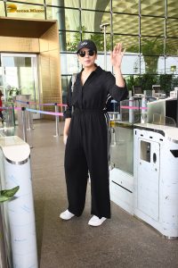 actress Huma Qureshi in black overalls at airport