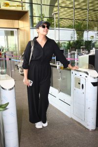 actress Huma Qureshi in black overalls at airport