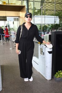 actress Huma Qureshi in black overalls at airport