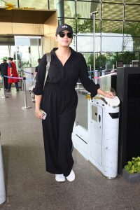 actress Huma Qureshi in black overalls at airport