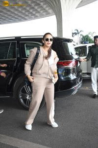 bollywood actress Huma Qureshi in light brown tracks at mumbai airport