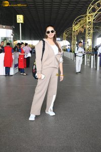 bollywood actress Huma Qureshi in light brown tracks at mumbai airport