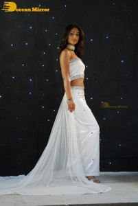 Ileana D’Cruz wearing a white dress and a tiara for a photoshoot