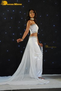 Ileana D’Cruz wearing a white dress and a tiara for a photoshoot