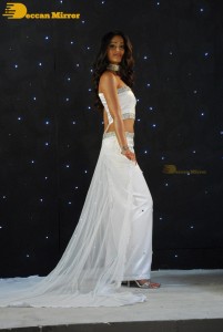 Ileana D’Cruz wearing a white dress and a tiara for a photoshoot