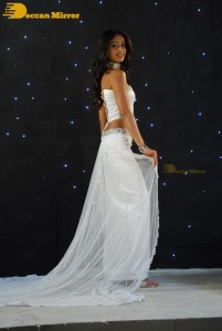 Ileana D’Cruz wearing a white dress and a tiara for a photoshoot