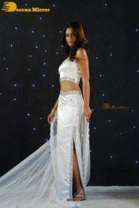 Ileana D’Cruz wearing a white dress and a tiara for a photoshoot