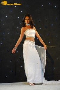 Ileana D’Cruz wearing a white dress and a tiara for a photoshoot