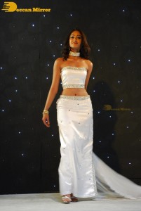 Ileana D’Cruz wearing a white dress and a tiara for a photoshoot