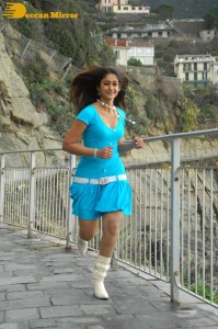Actress Ileana D’Cruz running in a blue dress