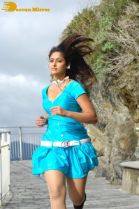Actress Ileana D’Cruz running in a blue dress