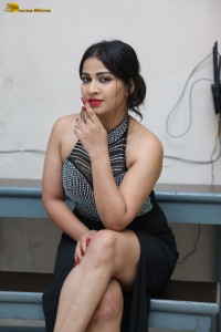 actress Inaya Sultana in a black top and matching skirt
