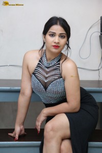 actress Inaya Sultana in a black top and matching skirt