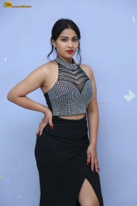 actress Inaya Sultana in a black top and matching skirt