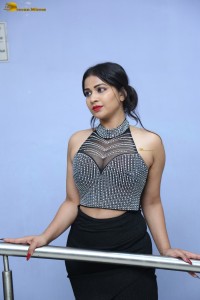 actress Inaya Sultana in a black top and matching skirt