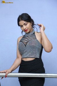 actress Inaya Sultana in a black top and matching skirt