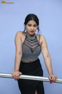 actress Inaya Sultana in a black top and matching skirt